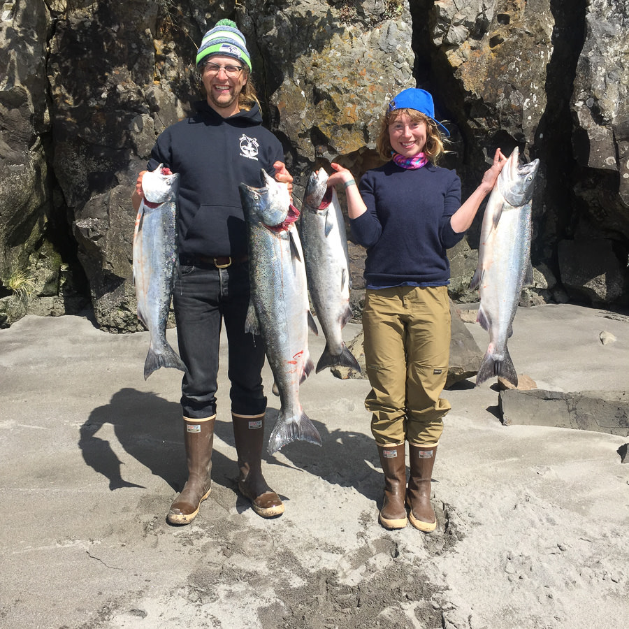 Couple hold up salmon they caught with Oregon fishing charter guide on the Columbia River
